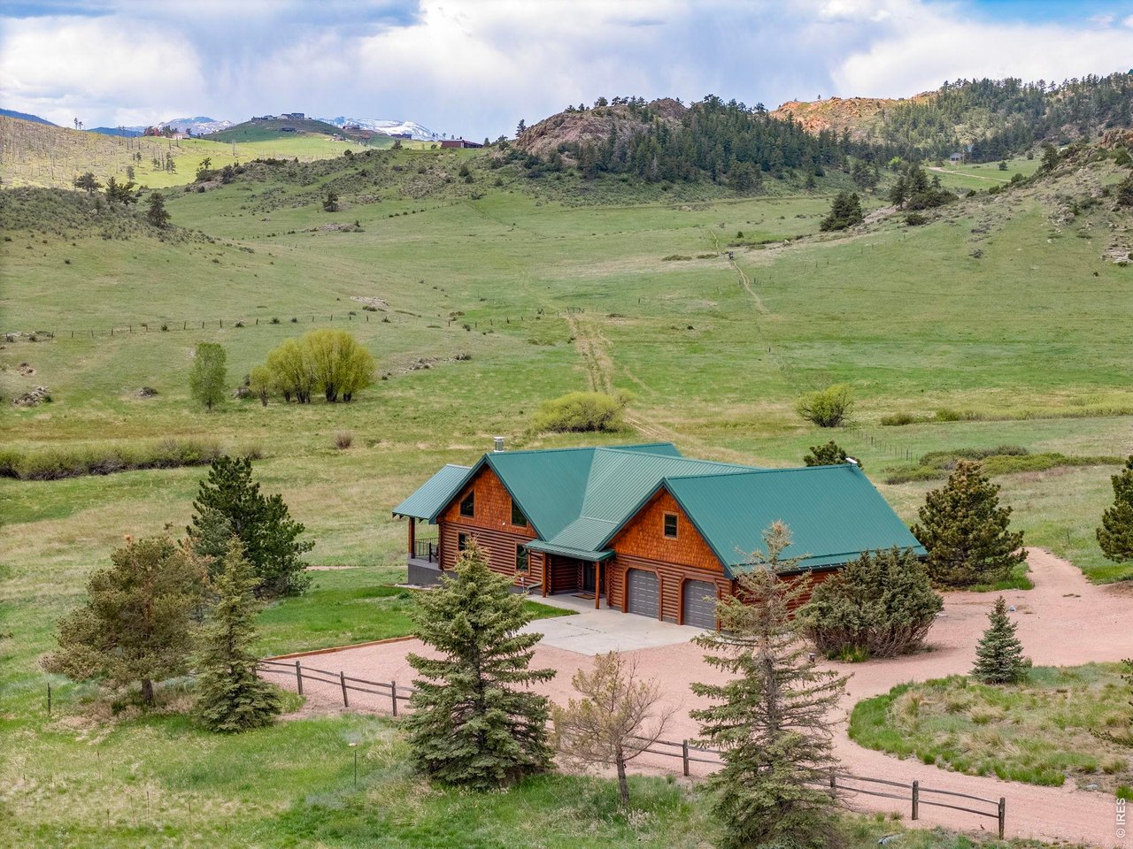 Property Photo 7 The log home features 3 bedrooms, 4 bathrooms plus a large loft space, home office, and more!