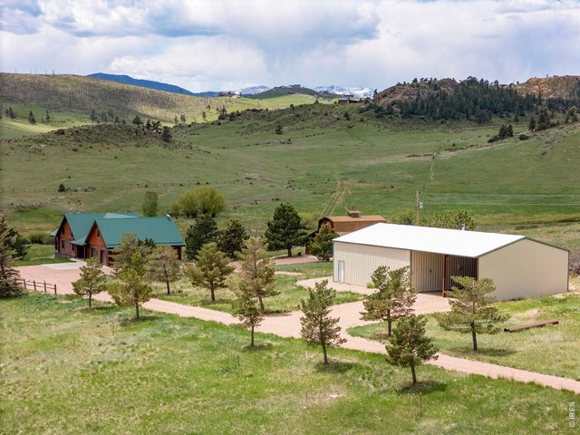Property Photo 6 This property features a 3,888 sq ft updated log home with 2 car attached and 2 car detached garages as well as a large 40'x40' outbuilding which includes 30'x40' of additional covered storage.
