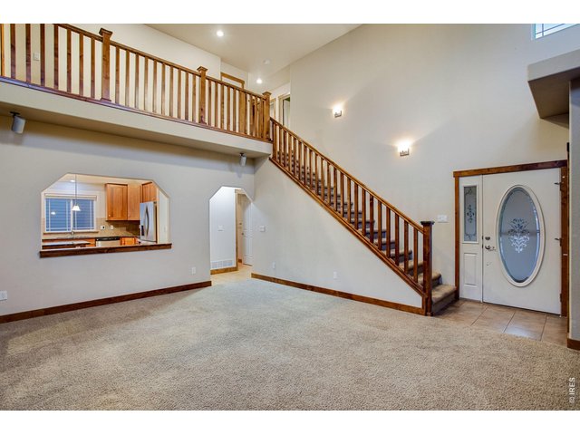 Property Photo 7 Spacious foyer with tile landing and coat closet