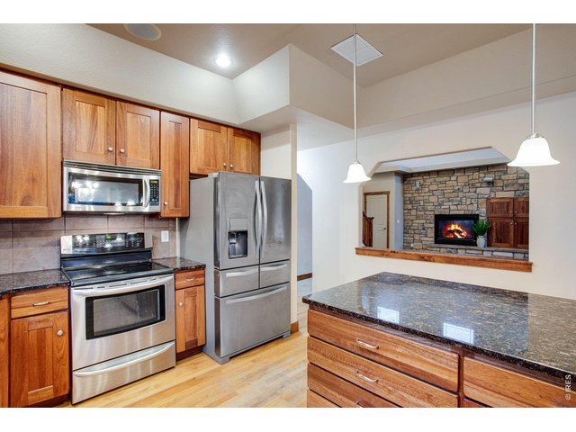 Property Photo 13 All stainless-steel appliances are included: refrigerator, electric range/oven, dishwasher, and microwave.