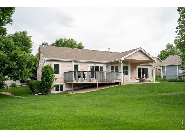 Property Photo 4 There is an expansive deck and a large covered patio. 