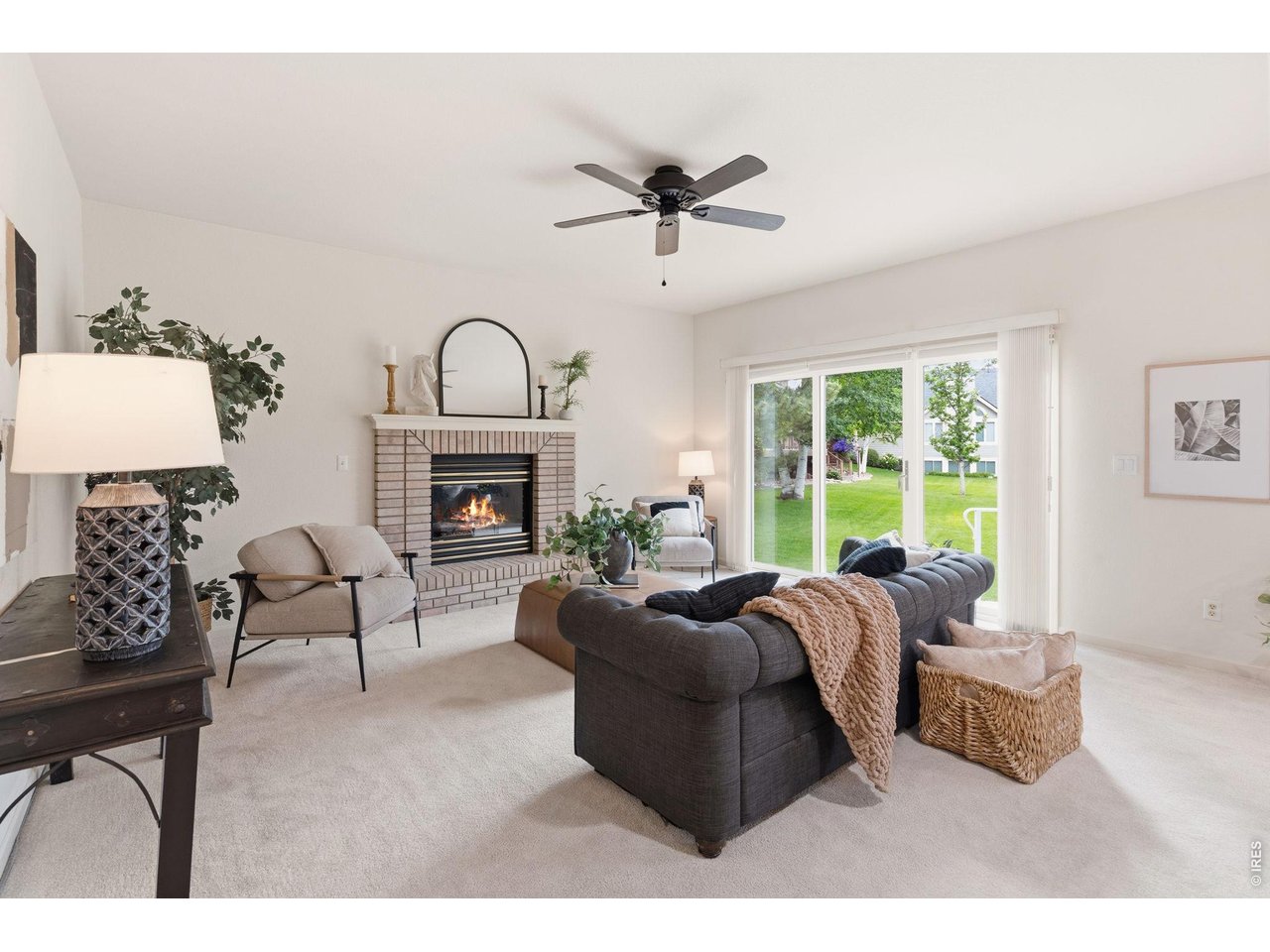 The great room is located off the kitchen area, and offers easy access to the large covered patio. 
