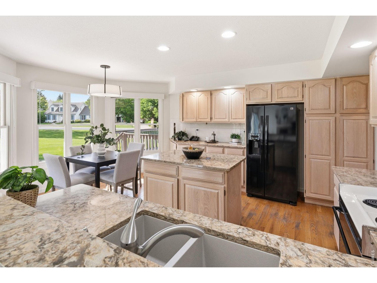 The large kitchen has a breakfast nook and a center island. 