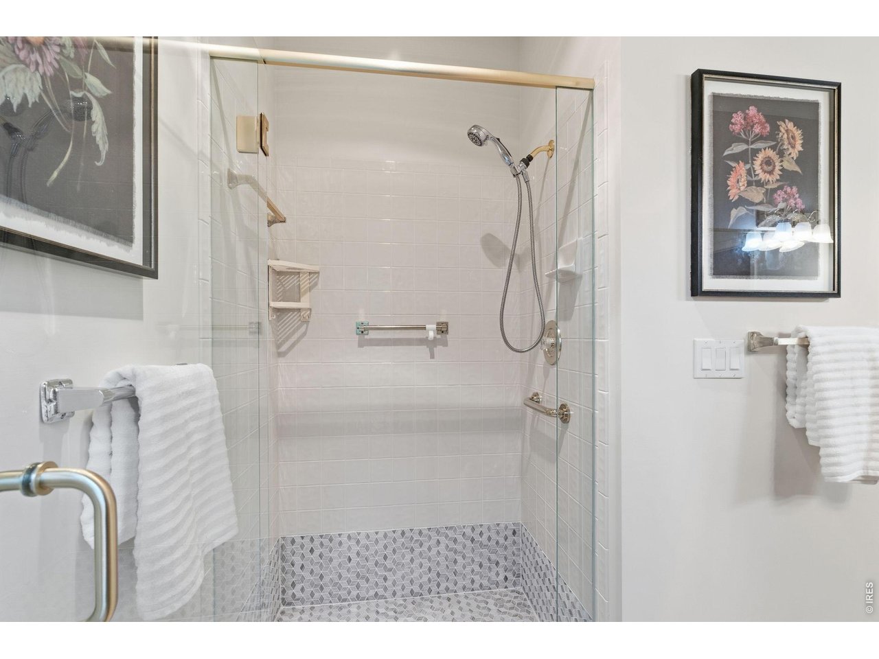 Convenient well designed zero entry shower. 