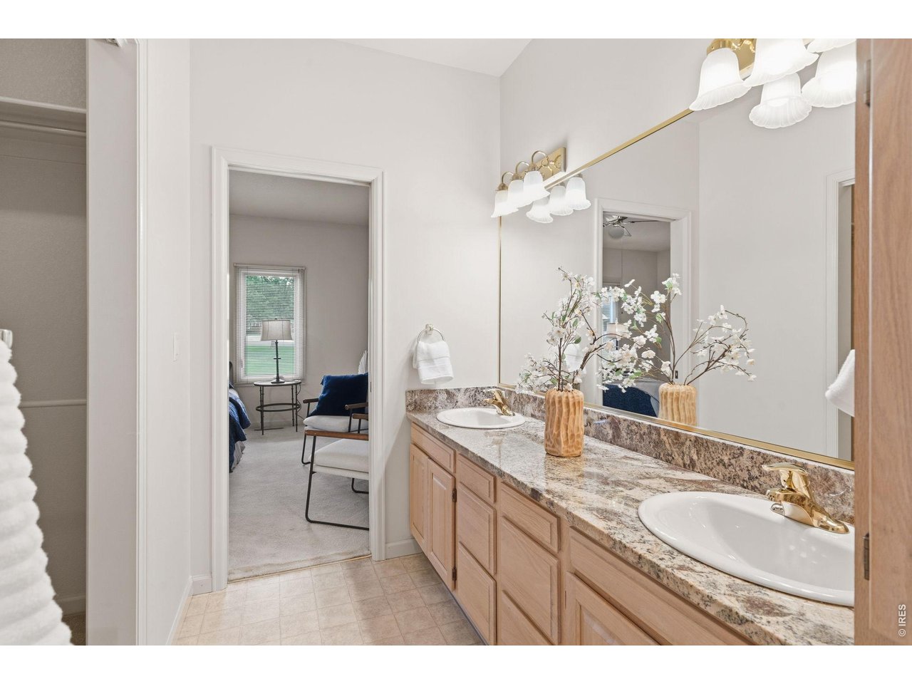 The large private primary bathroom has a double vanity area. 