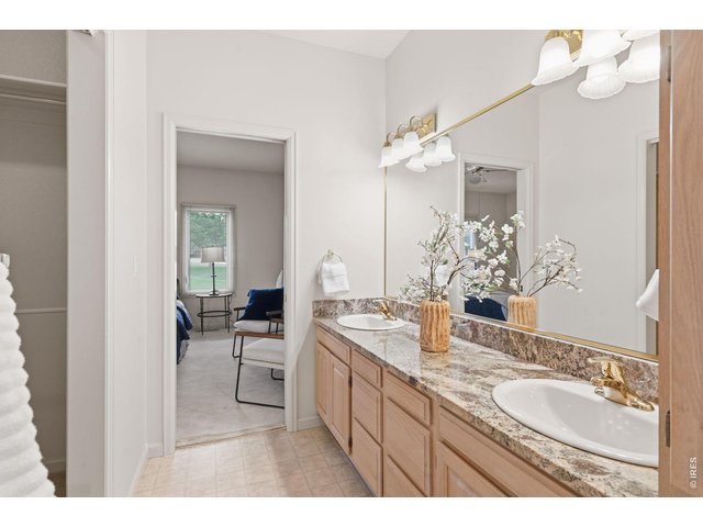 Property Photo 26 The large private primary bathroom has a double vanity area. 