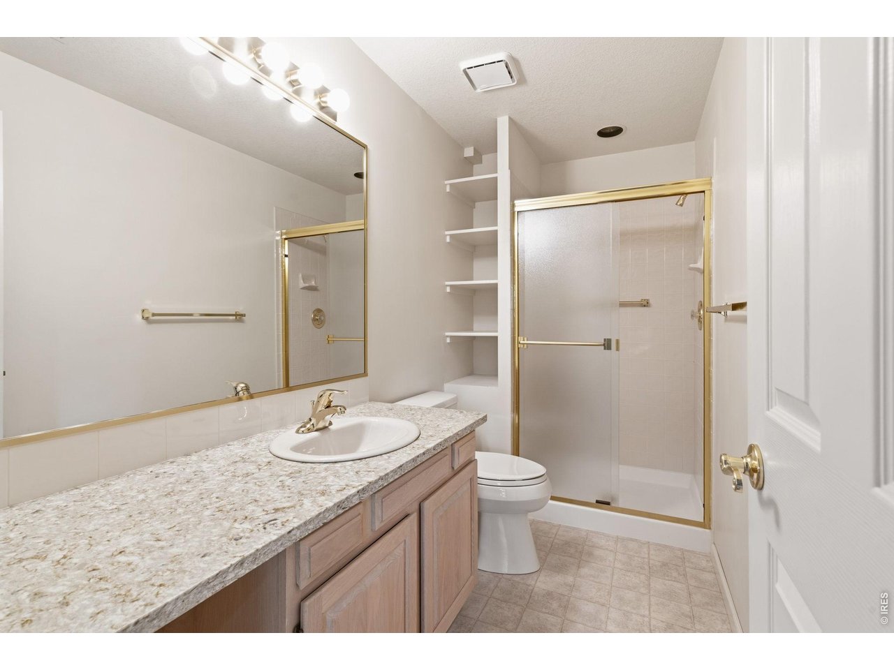 Basement bathroom is large and has a walk in shower. 