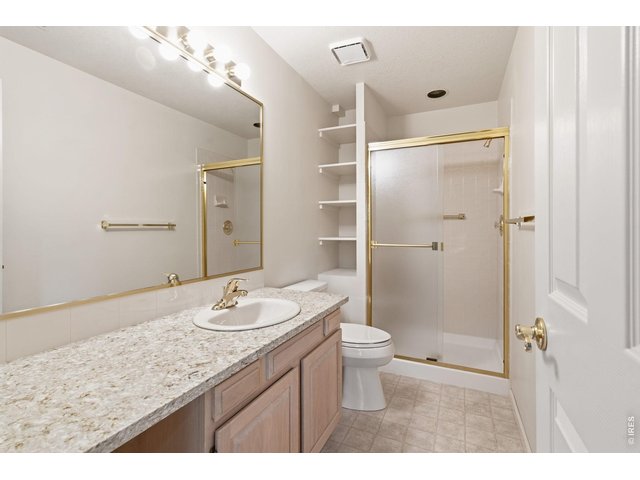 Property Photo 34 Basement bathroom is large and has a walk in shower. 