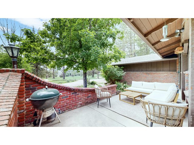 Property Photo 21 Out door living on partial covered patio. 