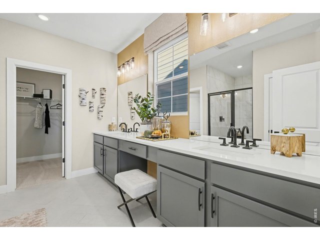 Property Photo 22 Dual vanities in the primary bathroom - Model Home