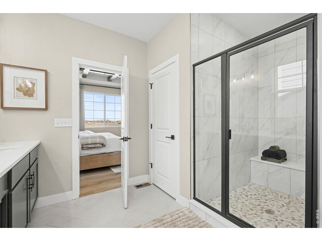 Property Photo 23 Primary shower - Model Home