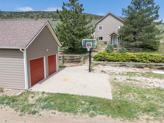 Property Photo 34 Detached two-car garage provides additional storage and workspace potential.