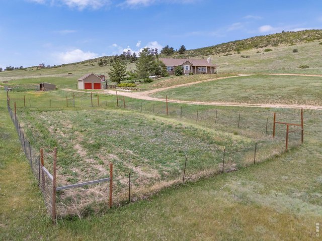 Property Photo 38 The fenced in garden space is 1/4 acre!