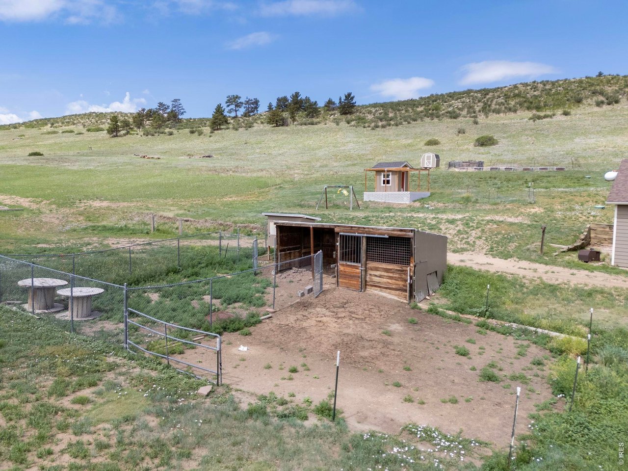 Property Photo 39 Open acreage offers flexibility for gardening, hobbies, or a variety of agricultural uses. 