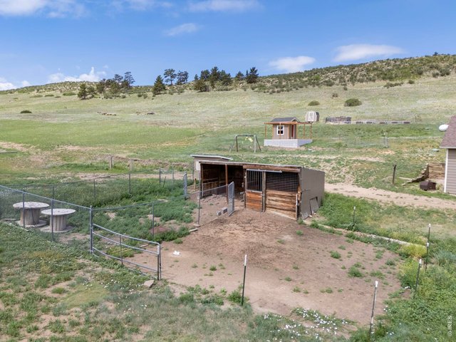 Property Photo 39 Open acreage offers flexibility for gardening, hobbies, or a variety of agricultural uses. 