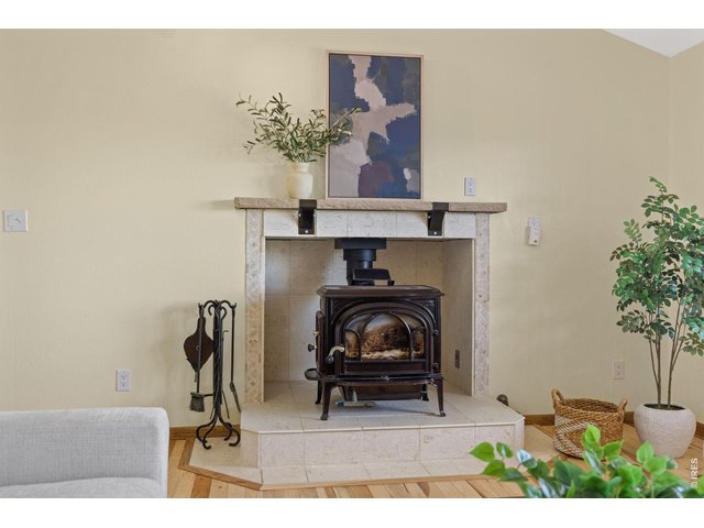 Property Photo 9 Wood stove adds warmth and character to the inviting living room.