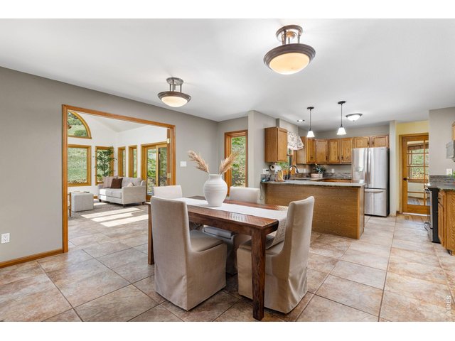 Property Photo 13 The Dining Room - Positioned adjacent to the kitchen for everyday convenience.