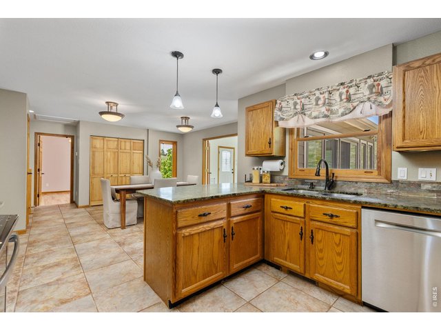 Property Photo 11 The Kitchen - A functional layout with an open connection to the dining area.