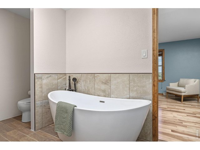 Property Photo 20 The soaking tub provides a comfortable place to unwind.
