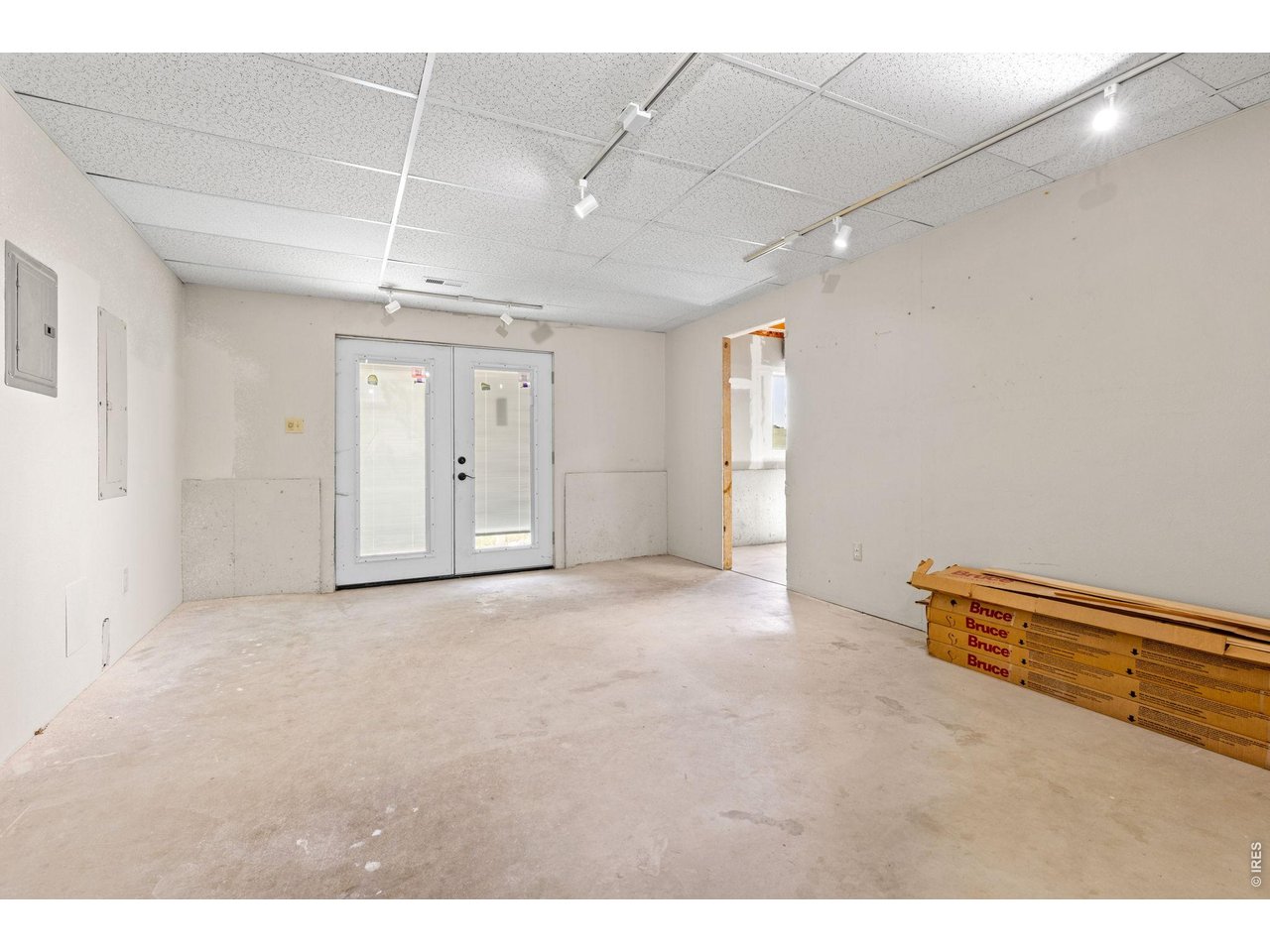 Property Photo 31 Basement Storage - Generous space for storage, hobbies, or future needs. French doors provide direct access to the outdoors.