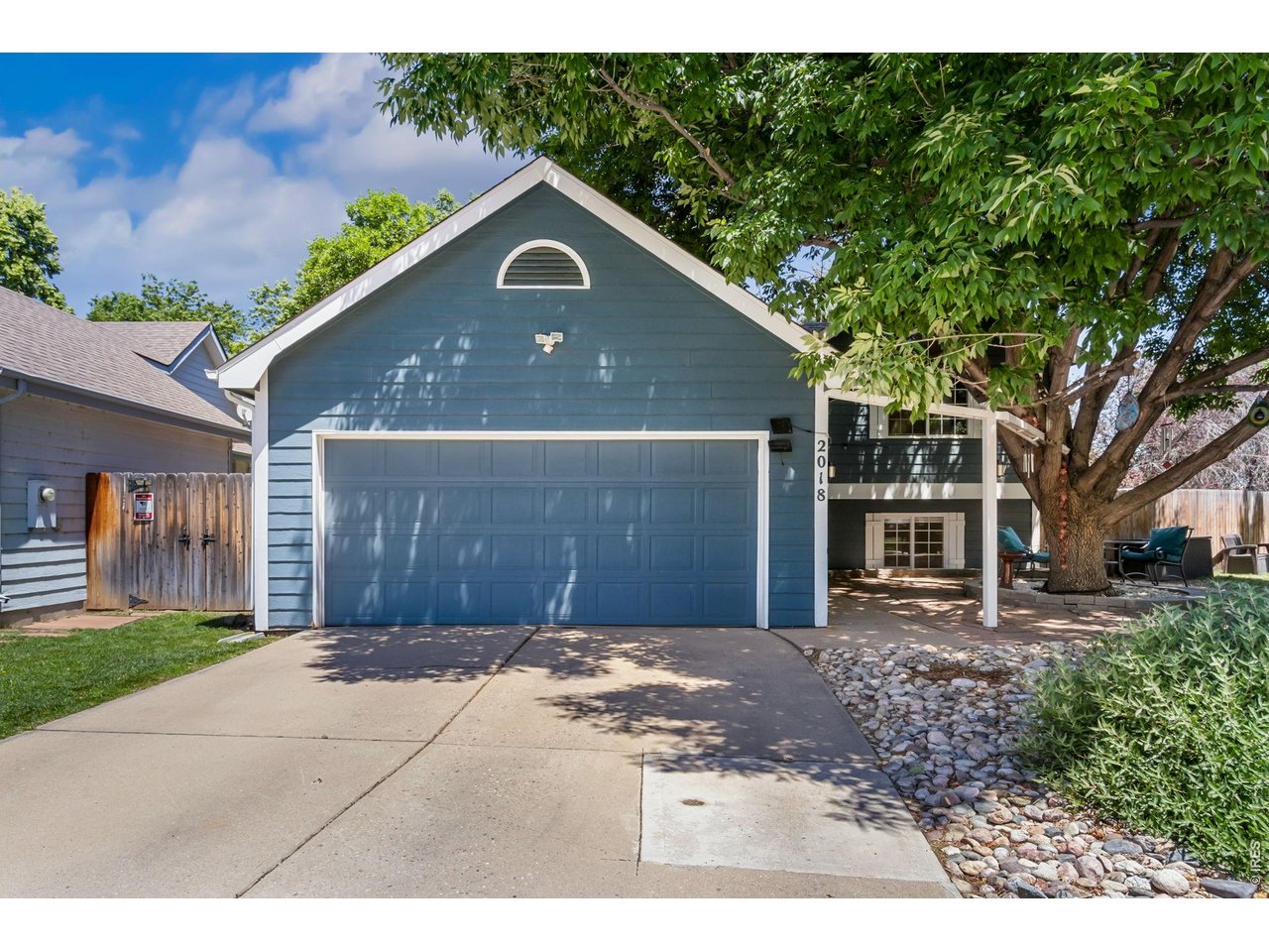 Property Photo 1 Welcome home! This charming move-in-ready home offers fantastic curb appeal, mature landscaping, and a welcoming front entrance.