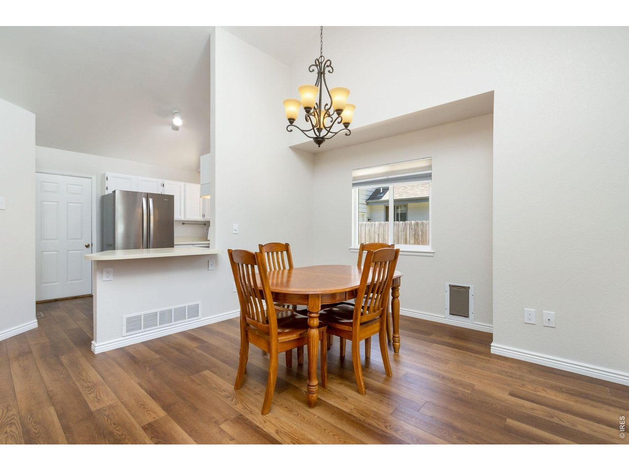 Property Photo 7 The kitchen is centrally located and open to the main living spaces, allowing the cook to stay connected to guests and family.