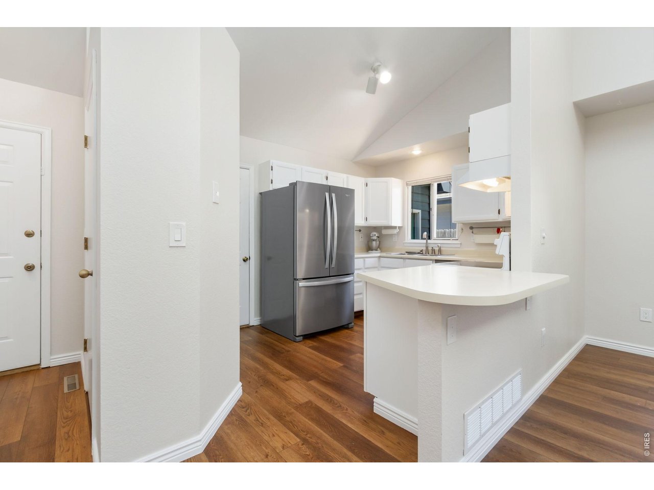 Property Photo 9 A convenient breakfast bar perfect for casual meals, homework, or visiting with guests.