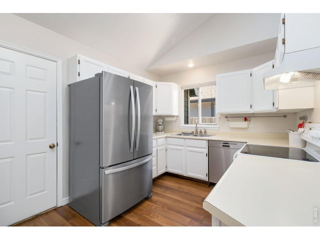 Property Photo 8 The thoughtfully designed kitchen offers ample workspace, abundance of cabinets.