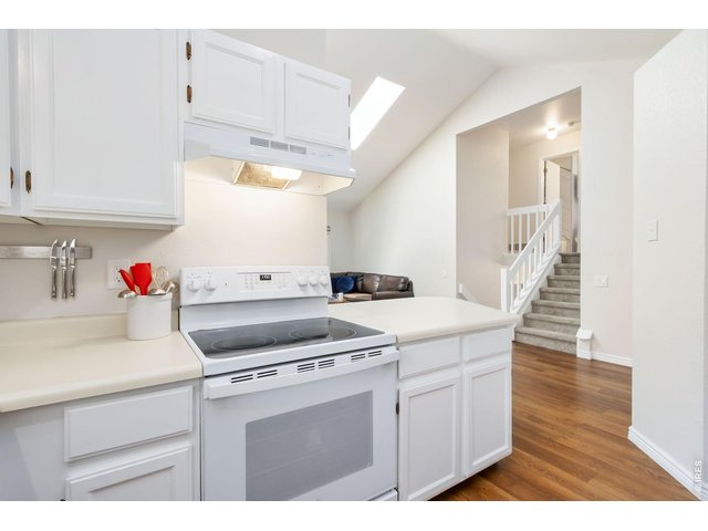 Property Photo 10 Open to the main living areas, this bright kitchen keeps everyone connected while entertaining or preparing meals.