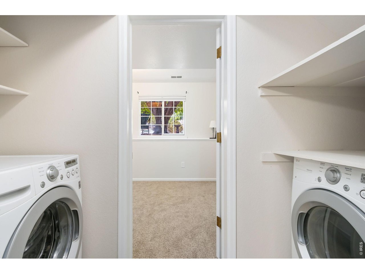 Property Photo 19 Convenient laundry space with additional storage to help keep daily routines organized.