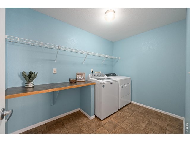 Property Photo 27 Upstairs Expansive Laundry Room with folding table - W&D stay