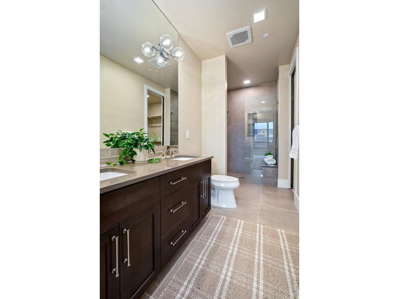 Property Photo 21 Large Primary Bathroom with Large zero threshold shower!