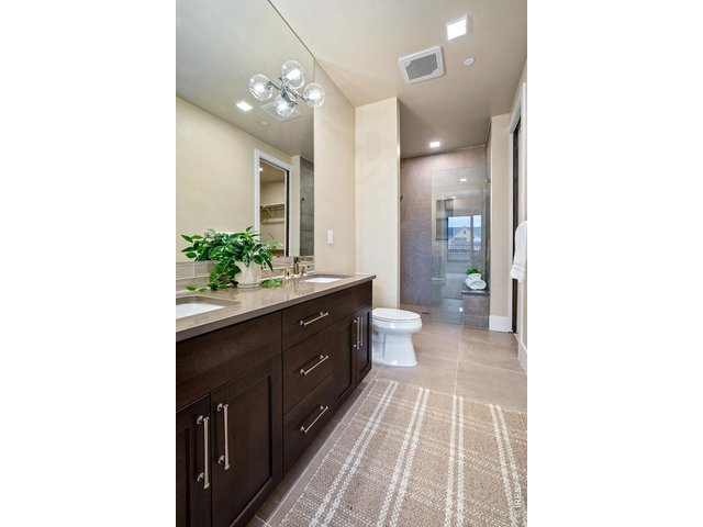 Property Photo 21 Large Primary Bathroom with Large zero threshold shower!