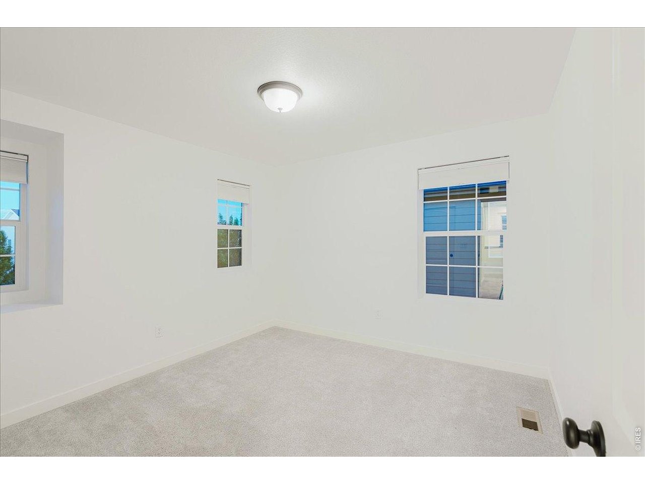 Bedroom 3 has a deep shelf at the window looking out the front of the house.