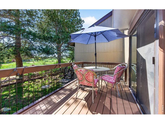 Property Photo 14 East facing deck off dining area