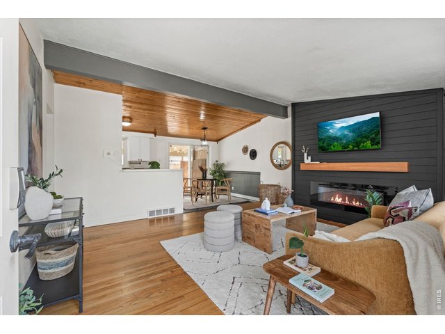 Property Photo 2 Open concept living, dining, and kitchen creates the perfect flow for everyday life and entertaining.