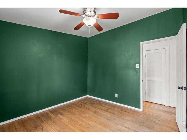 Property Photo 28 Secondary bedroom offers a calming retreat with new luxury vinyl plank flooring.