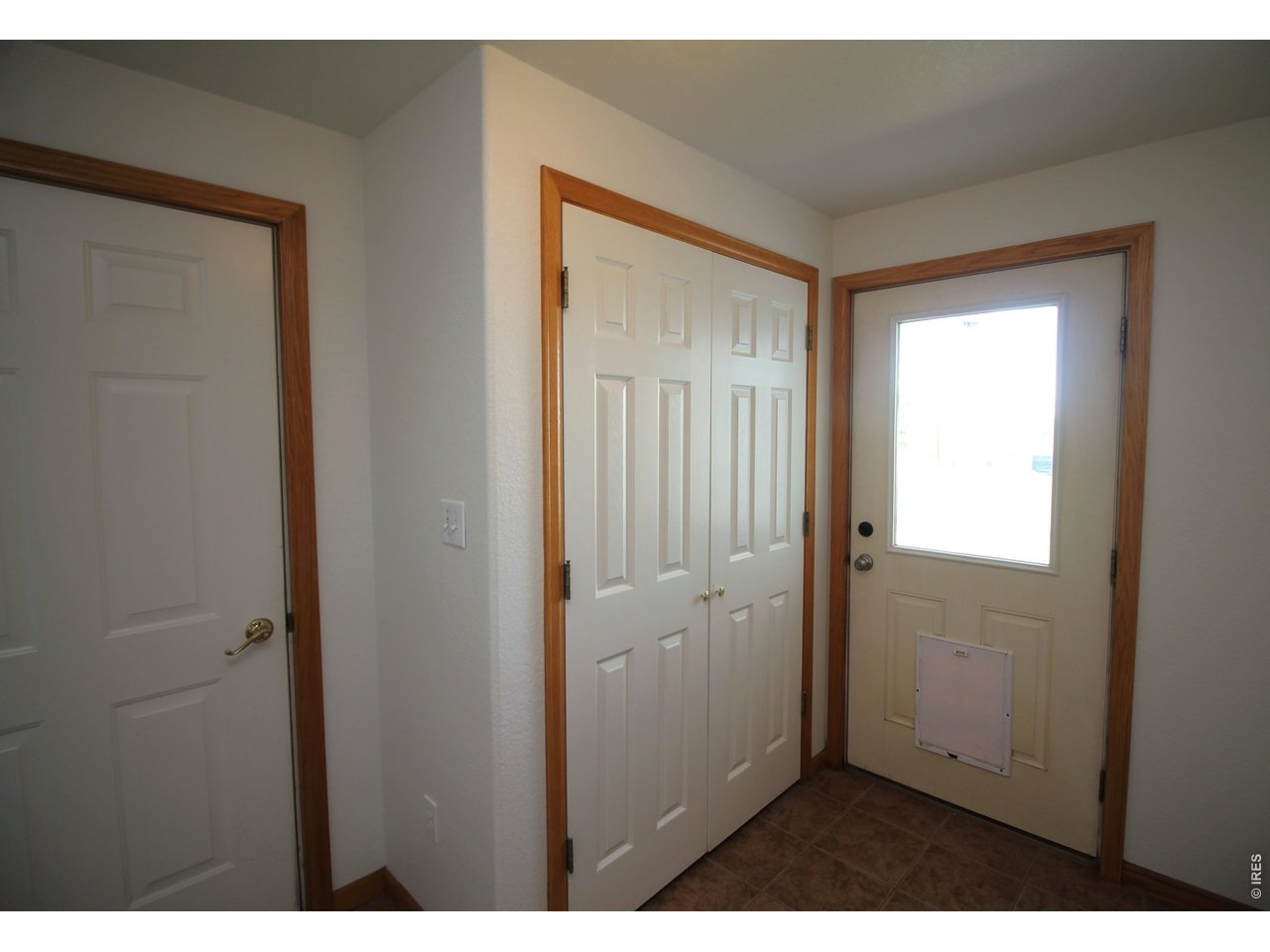 Property Photo 25 Mudroom door to the fenced back yard area