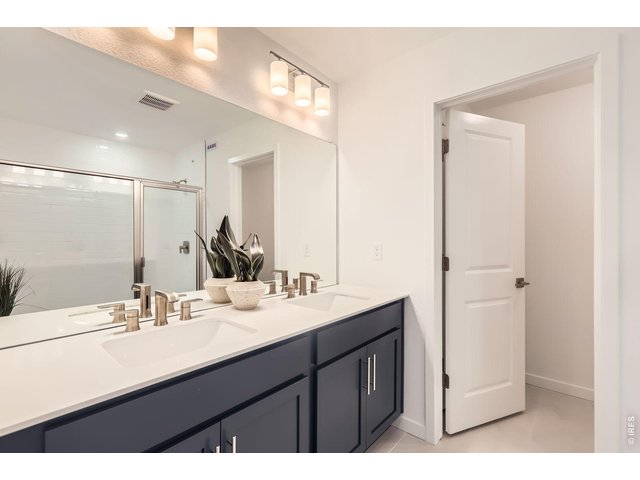 Property Photo 19 The primary bathroom - Model Home