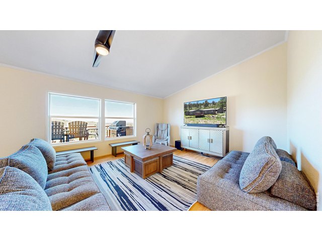 Property Photo 8 Large windows off the living area to showcase the views