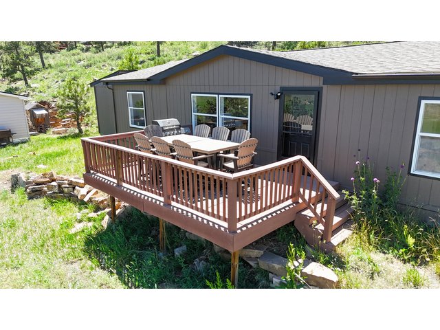 Property Photo 3 New front porch faces East, making a great area to sit and take in the mountain air watching the sunrise. 