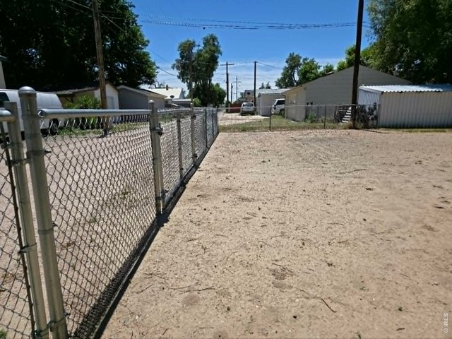 Property Photo 16 Gated back with single gate and 2 large gates for for RV, boats and more to park