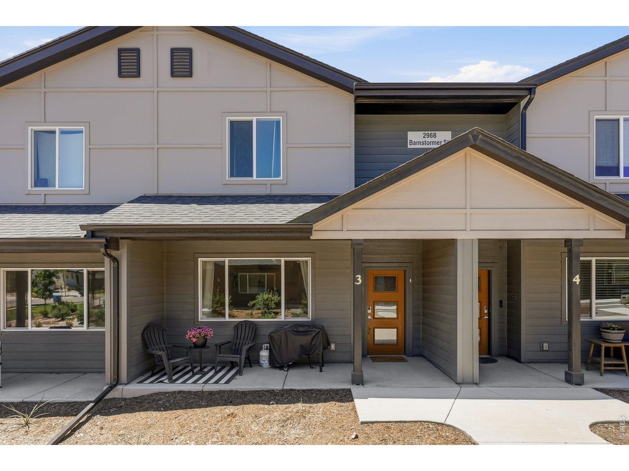 A charming front patio welcomes you into a bright, open-concept floor plan