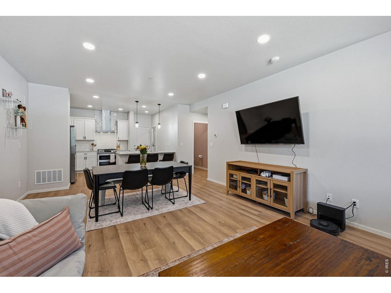 Bright open-concept floor plan featuring a generous living room, dining area, and stylish kitchen 