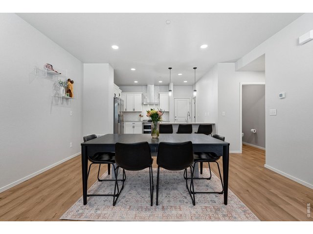 Property Photo 6 Bright open-concept floor plan featuring a generous living room, dining area, and stylish kitchen 