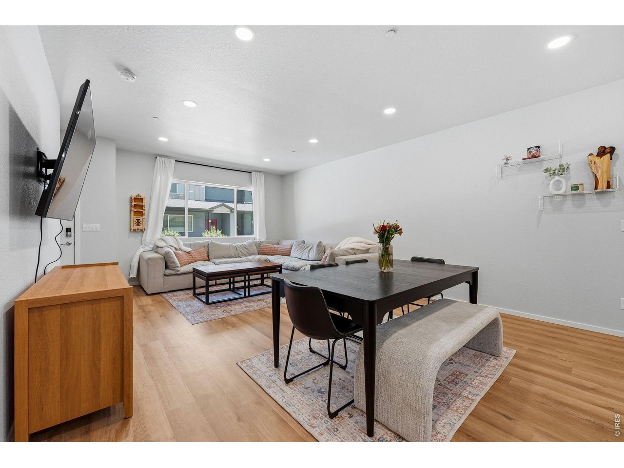 Luxury vinyl plank flooring extends throughout the main level