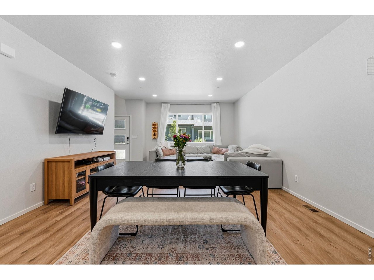 Luxury vinyl plank flooring extends throughout the main level