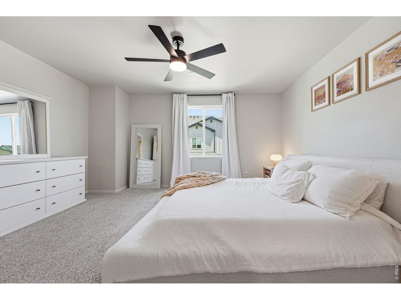 Primary suite offers a walk-in closet and private bath