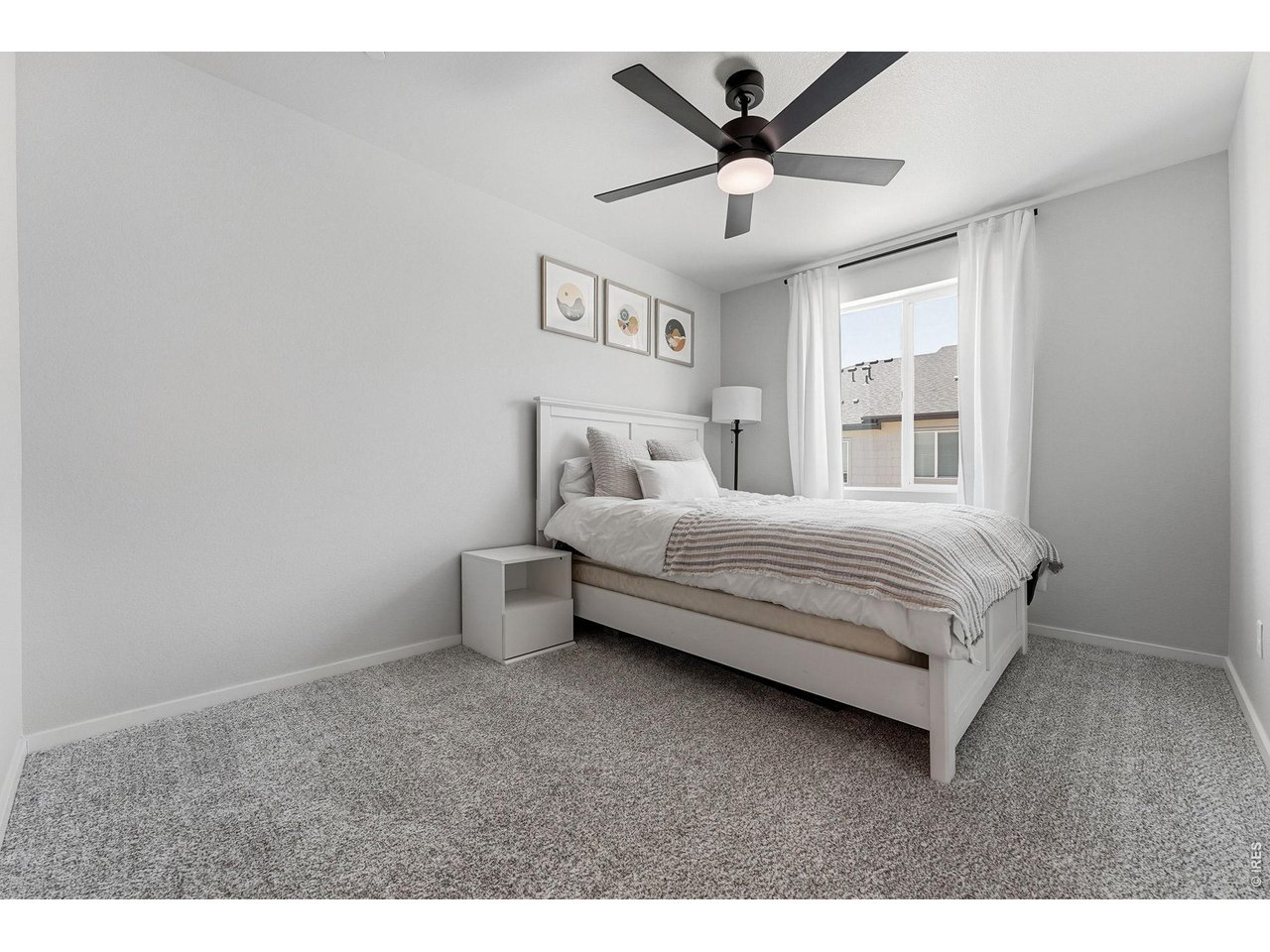 Two additional bedrooms feature walk-in closets and share a full bath