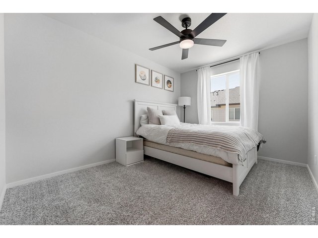 Property Photo 24 Two additional bedrooms feature walk-in closets and share a full bath